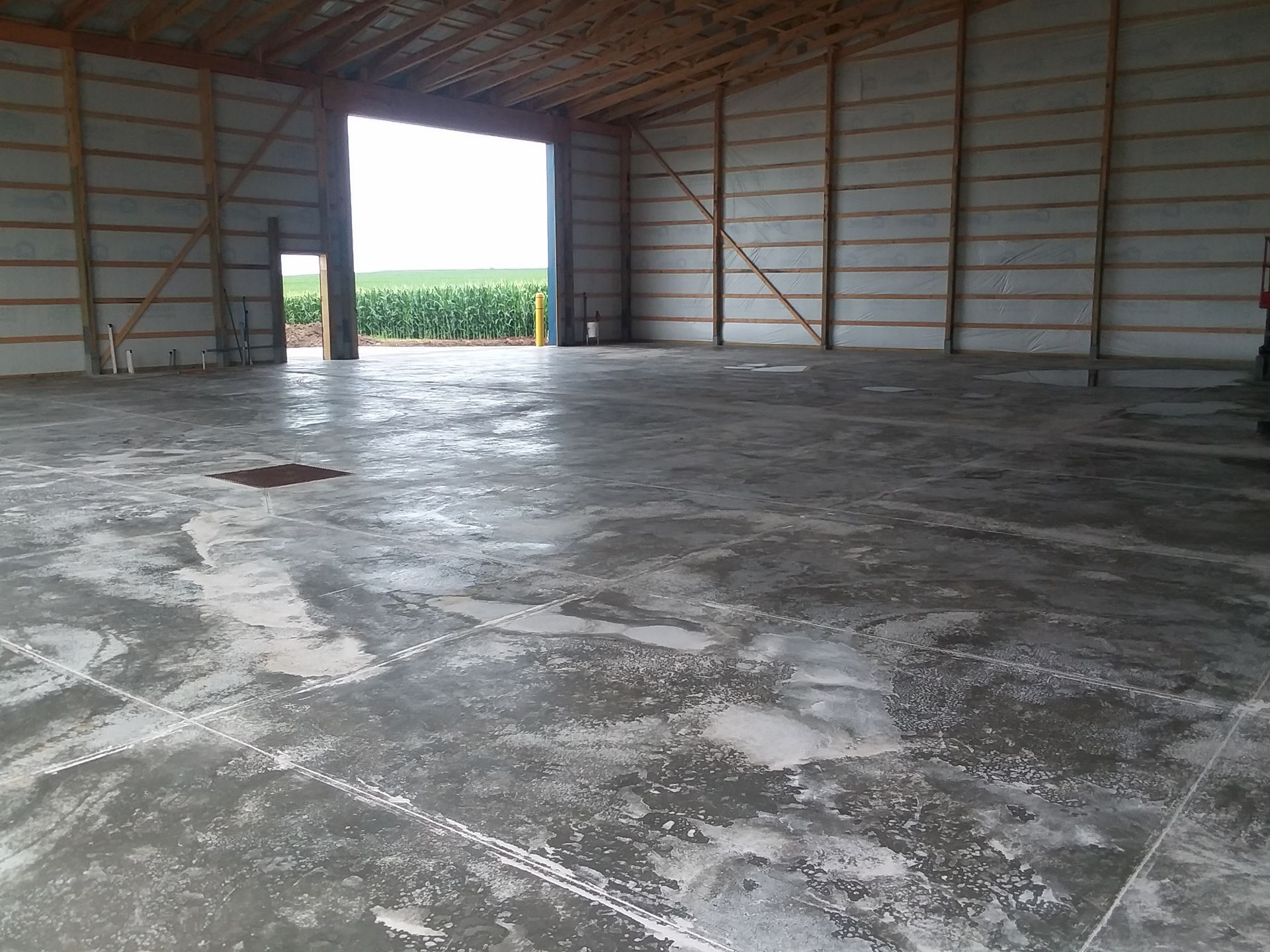 The inside of a building with a concrete floor