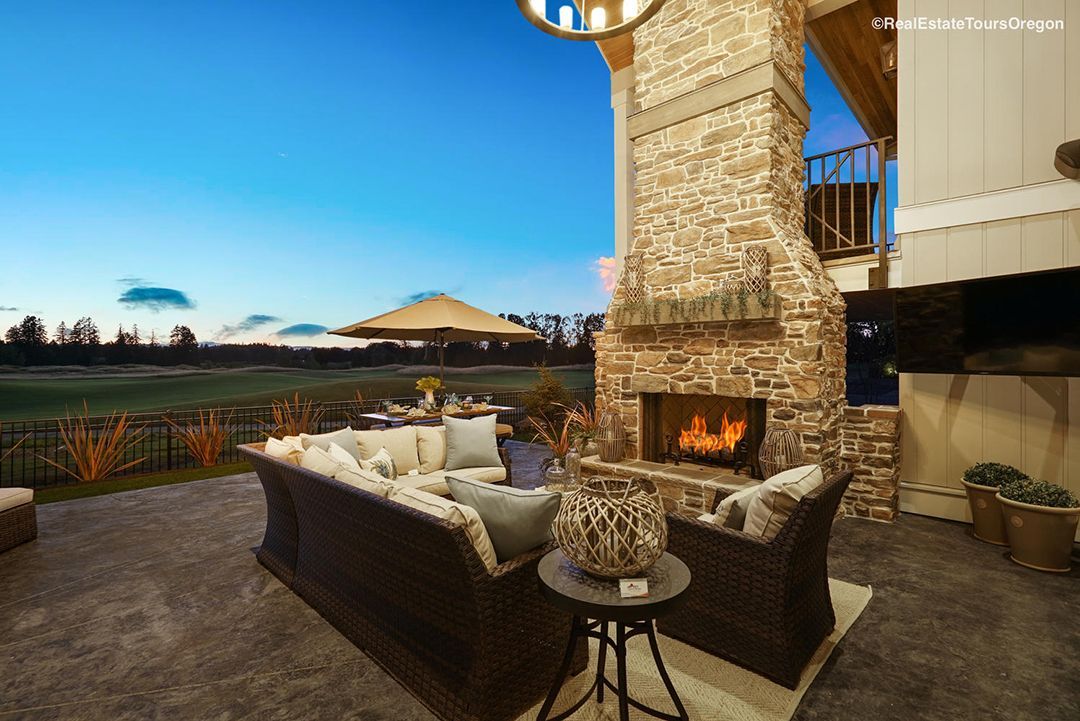 A patio with a fireplace and a couch