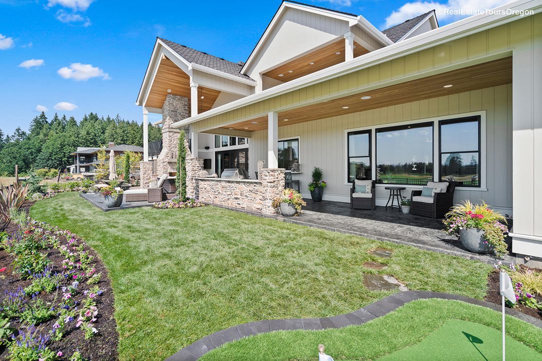 A large house with a mini golf course in front of it.