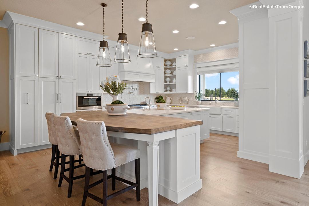 There is a large island in the middle of the kitchen.