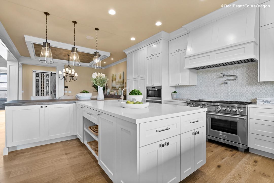There is a large island in the middle of the kitchen.