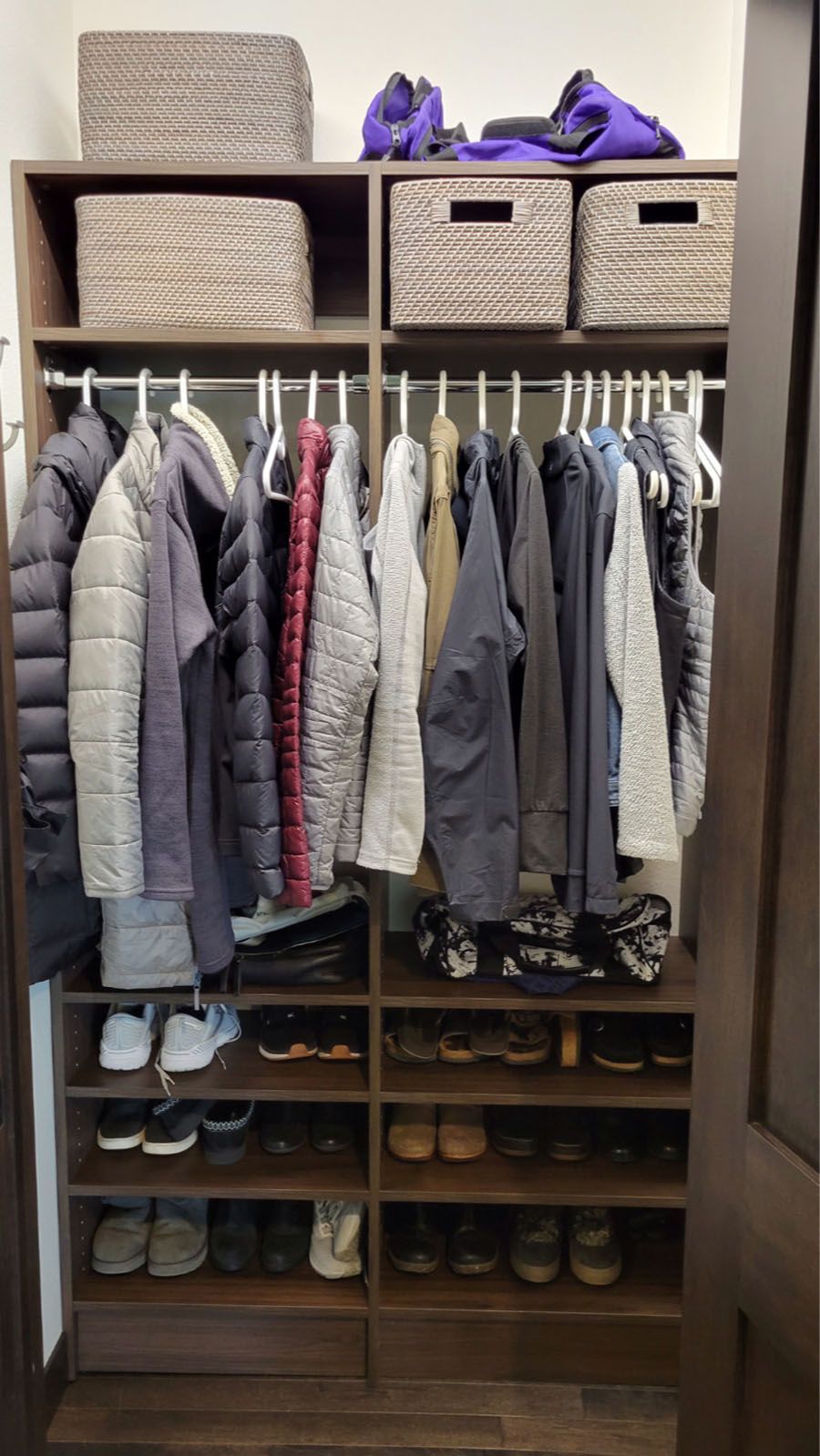 A closet filled with clothes and shoes