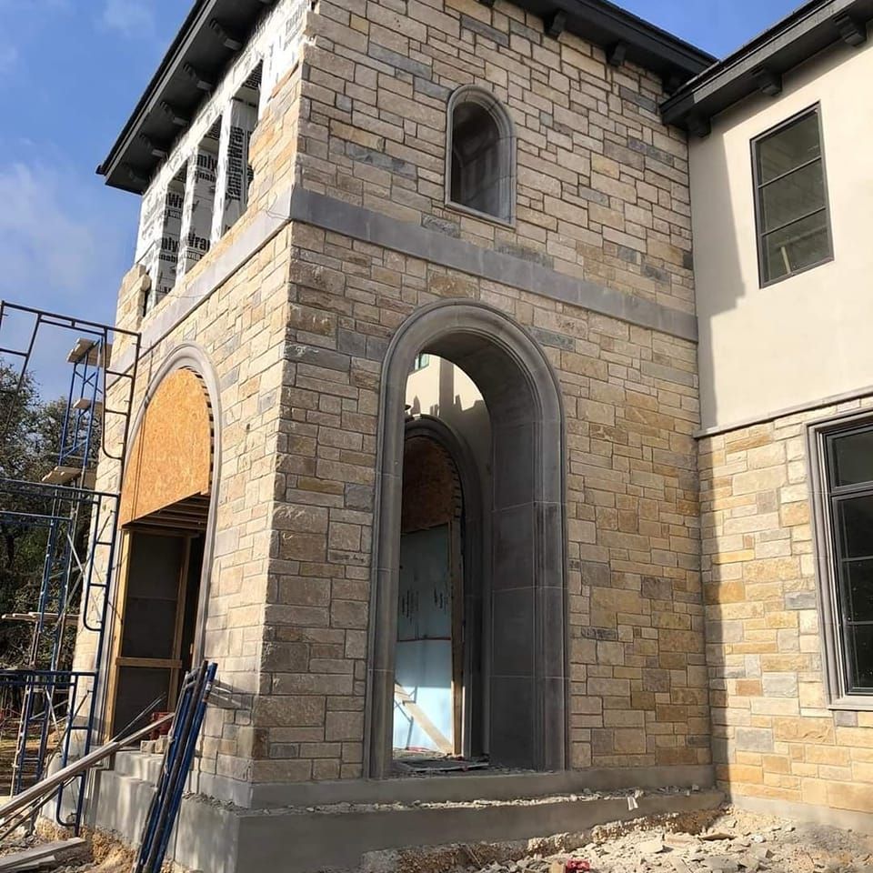 A large brick building under construction with scaffolding around it