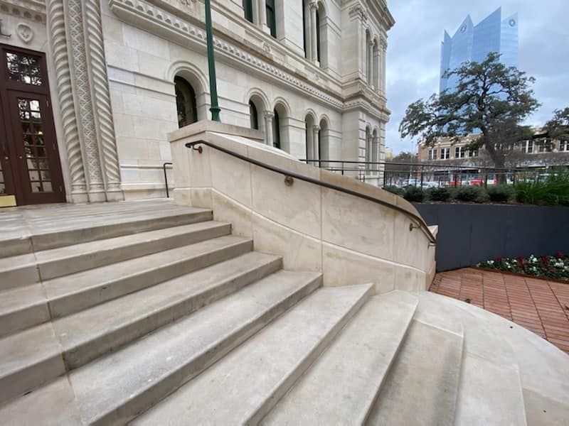 A curved set of stairs leading up to the city hall