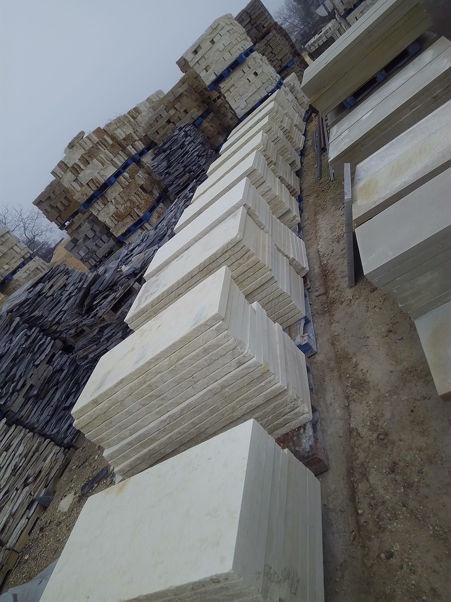 A pile of white blocks stacked on top of each other in a pile.