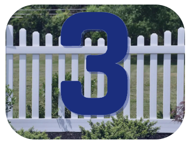 A white picket fence with a blue number 3 on it