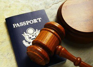 Learn More About Immigration Passport and gavel on a table