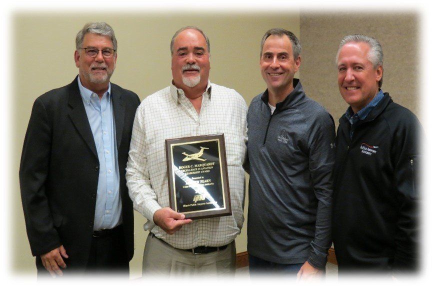 Group of men with award