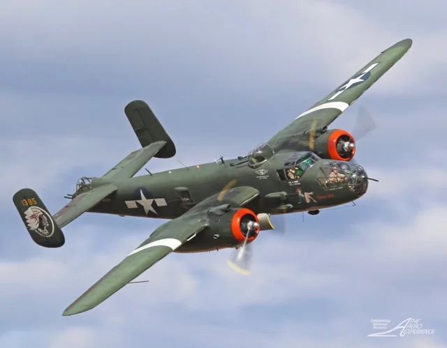 A plane with a star on the tail is flying in the sky