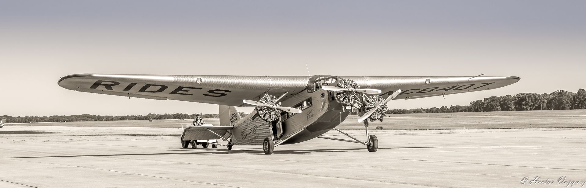 A black and white photo of a small airplane with the word ridge on the wing