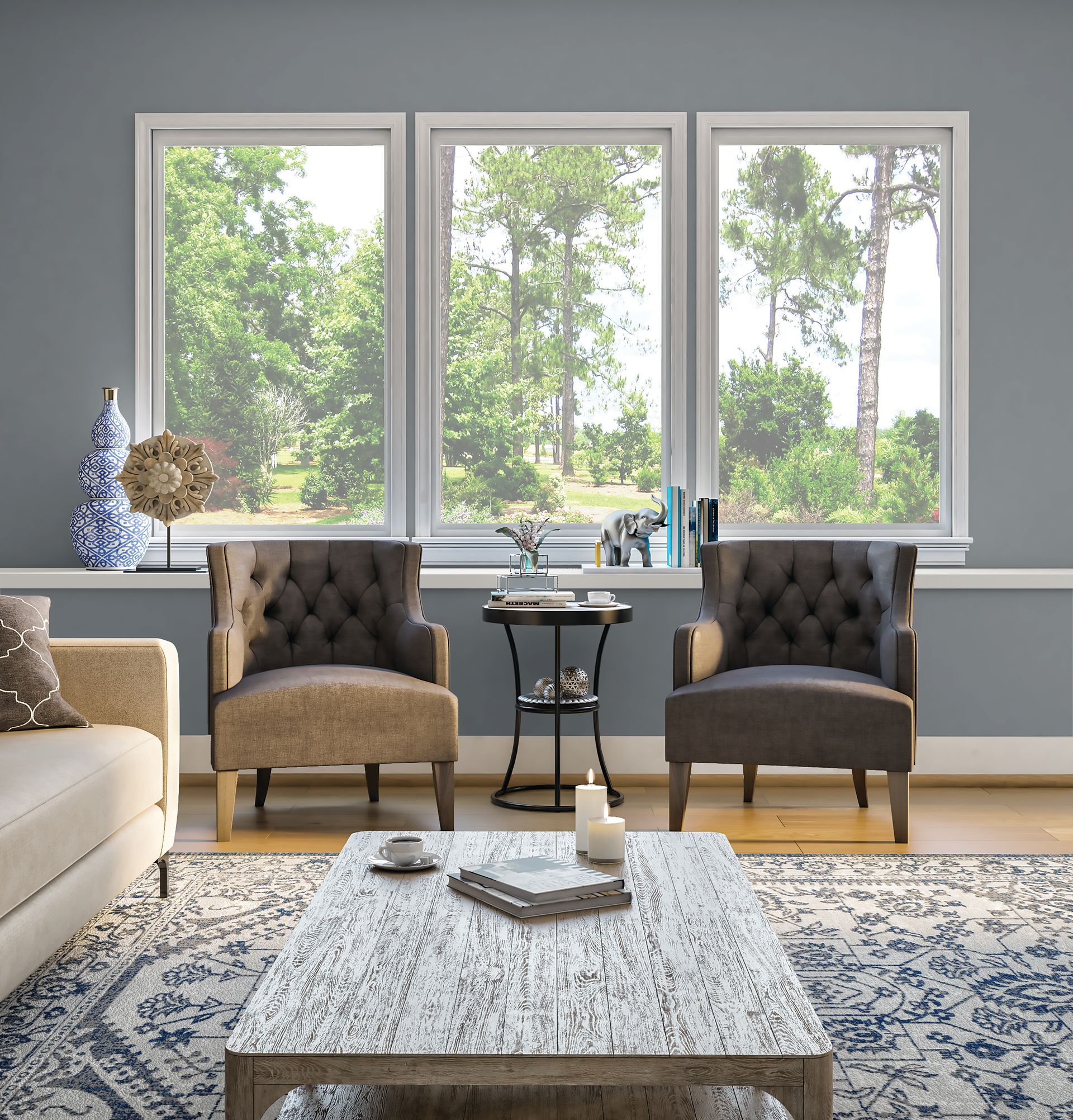 Modern living room with white furniture, large windows, ocean view, and a TV mounted on the wall.
