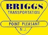 Yellow sign with "BRIGGS TRANSPORTATION" above "POINT PLEASANT N.J." in blue and black text.