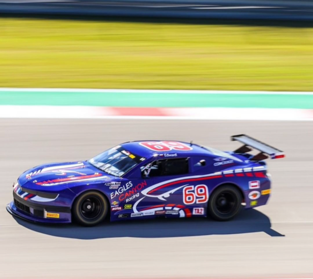 A blue race car with the number 69 on it