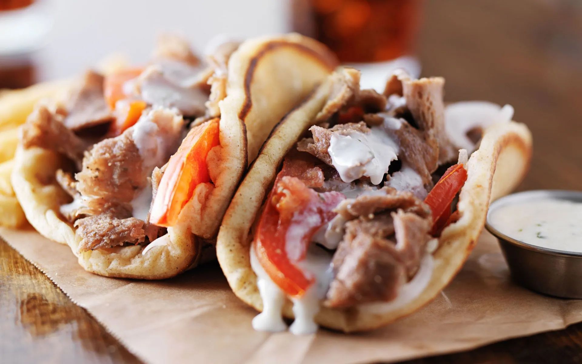 a close up of a gyro sandwich on a table