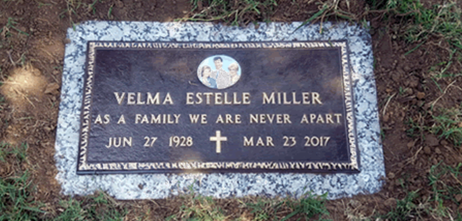 Bronze grave marker for Velma Estelle Miller, born June 27, 1928, died March 23, 2017, featuring a small family photo.