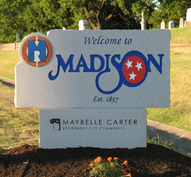 A stone sign in Madison, Tennessee, welcoming visitors and noting the Maybelle Carter Retirement Life Community.