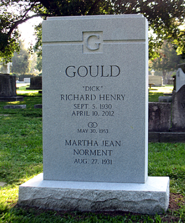 A granite headstone for the Gould family in a cemetery, inscribed with memorial dates for Richard and Martha Gould.