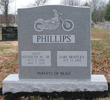 A gray granite headstone for Kenneth 
