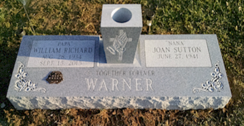 A grey granite companion headstone for William Richard and Joan Sutton Warner, reading 