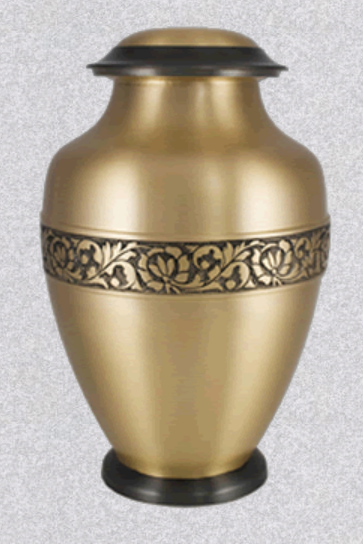 A metallic gold cremation urn with a black base, lid, and a decorative etched floral band around the center.