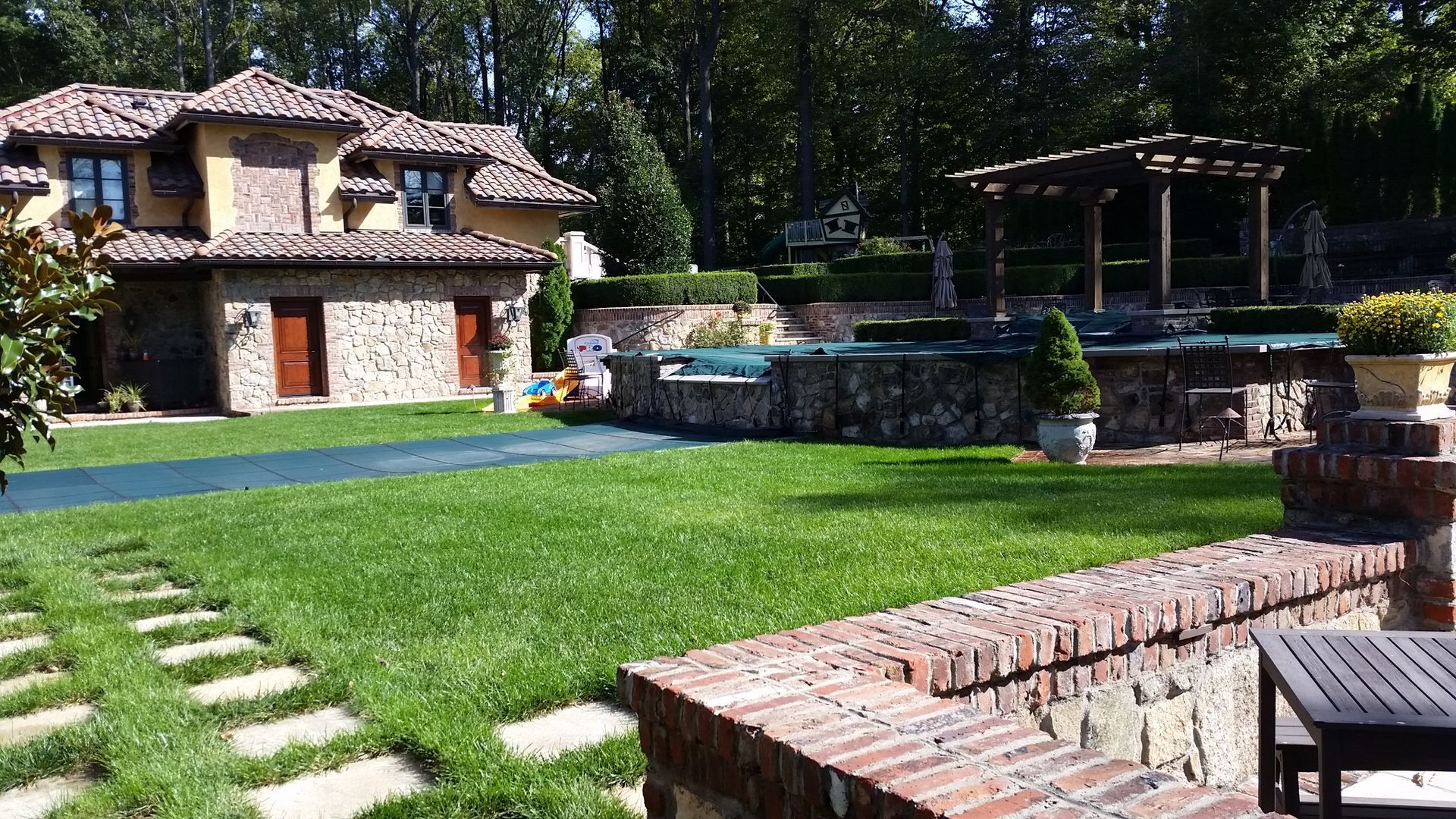 A large house with a large lawn in front of it