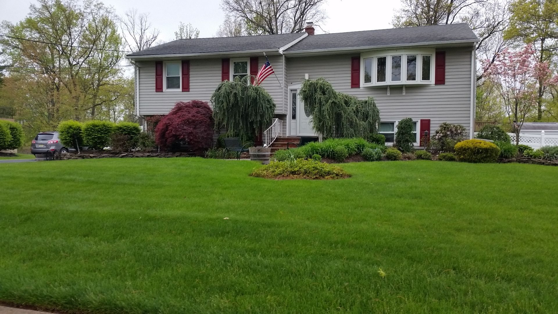 A large house with a large lawn in front of it