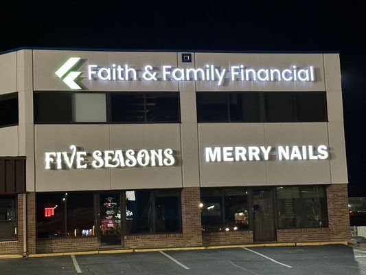 Office building with illuminated signs: 