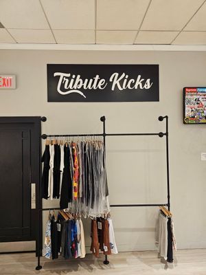 Clothing store interior: black sign 