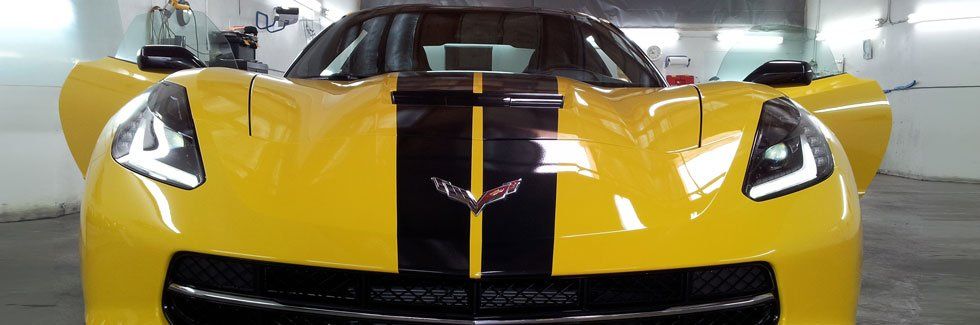 Yellow Corvette with Doors open