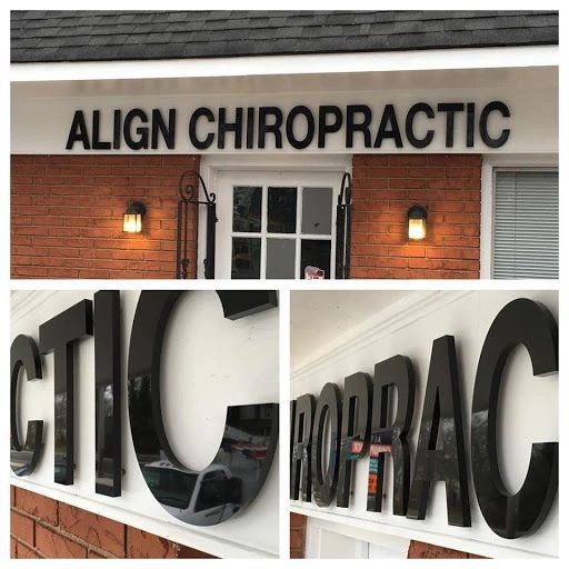 Exterior view of a brick building with a sign that reads 