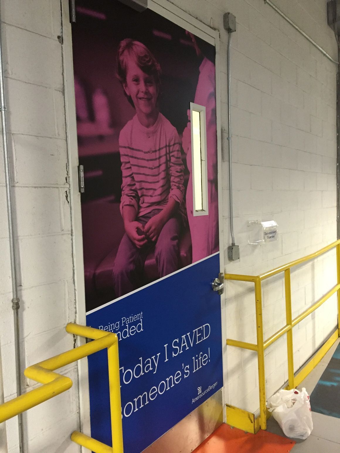 A door featuring a purple-tinted photo of a smiling child and the text, 