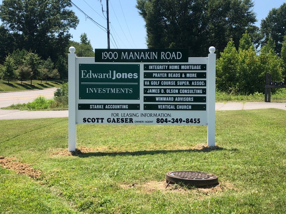 A white sign at 1900 Manakin Road lists Edward Jones and other businesses, with contact info for leasing at the bottom.