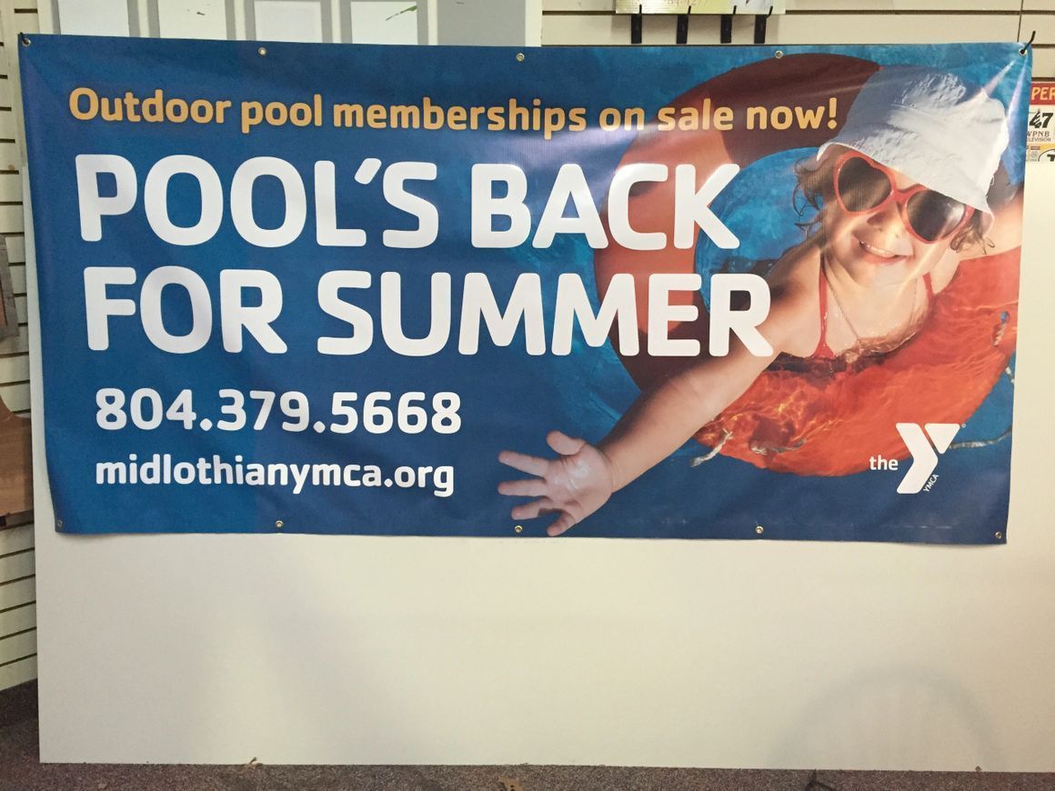 A YMCA banner advertises outdoor pool memberships with the text 