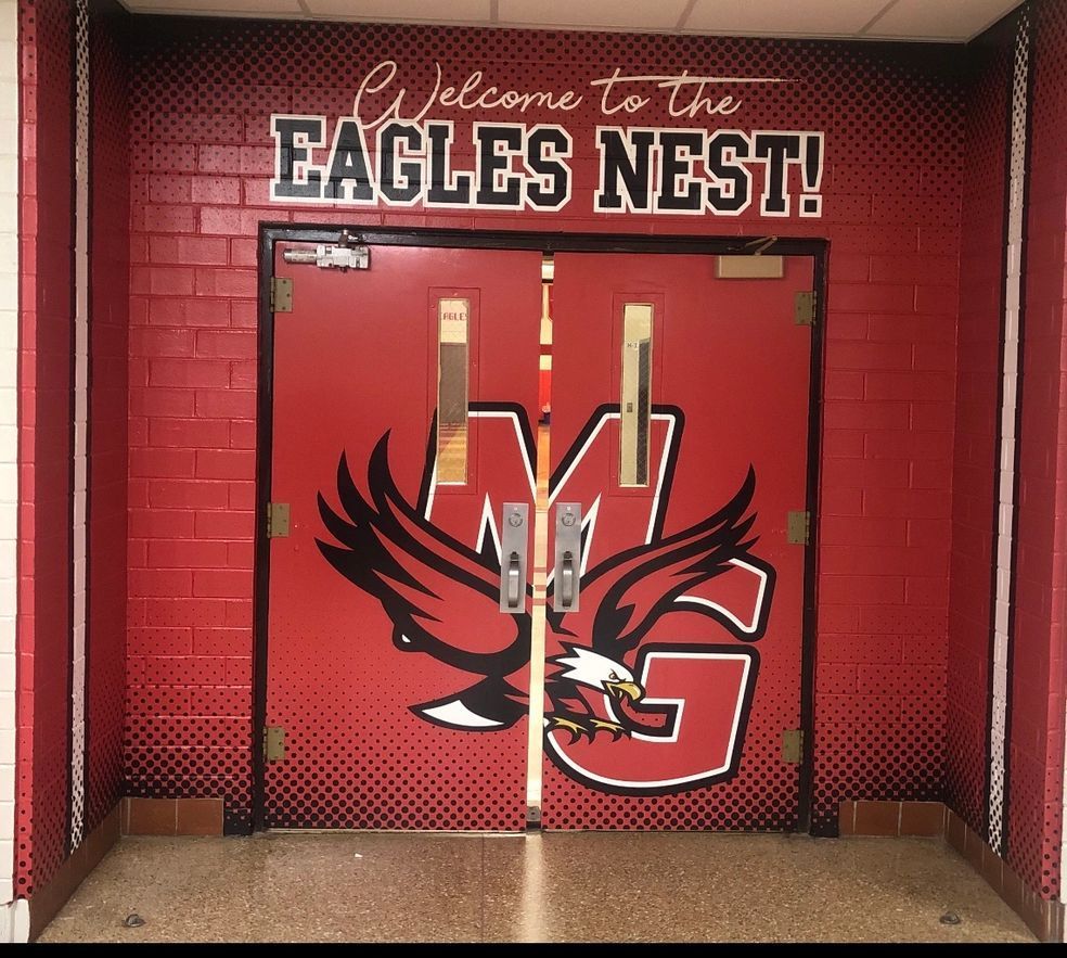 Red double doors labeled 