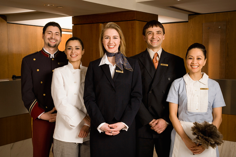A group of hotel staff posing for a picture together