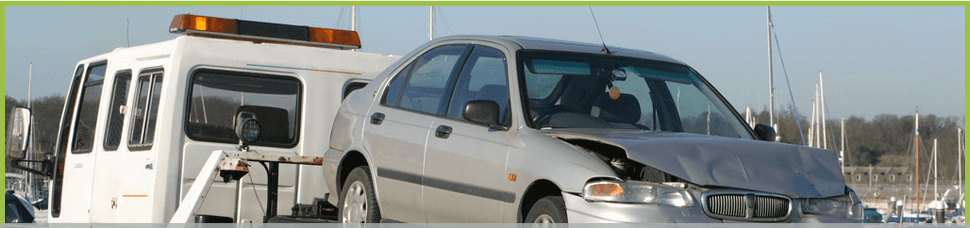 Towtruck carrying a damaged car