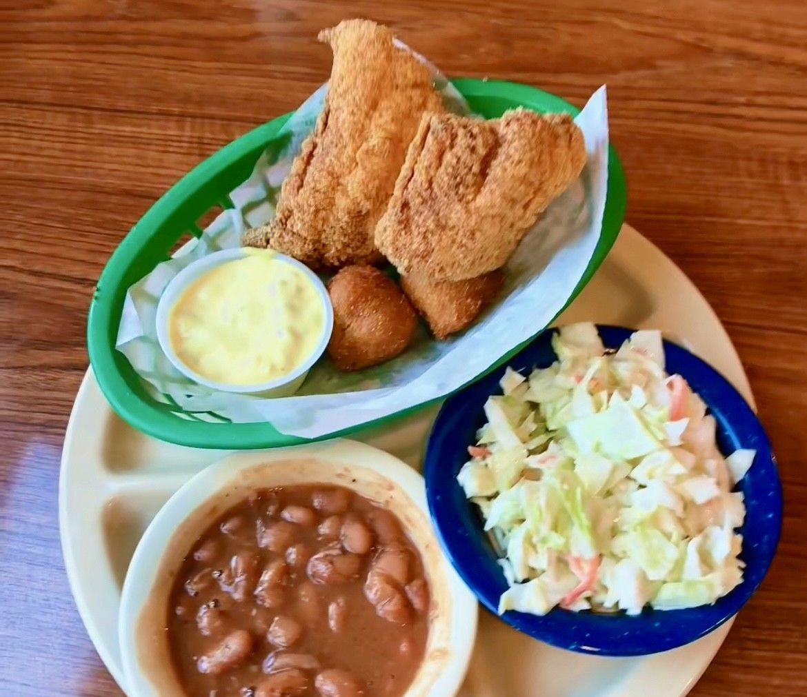 Fried fish basket with coleslaw and baked beans.