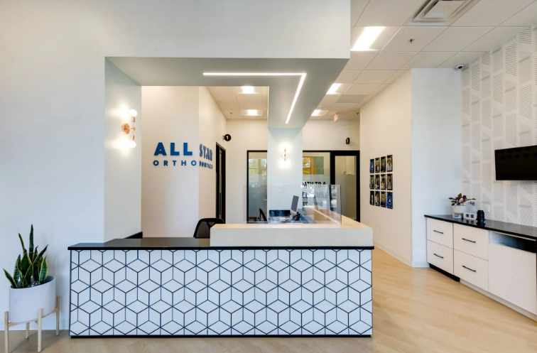 Reception area with geometric patterned desk, 