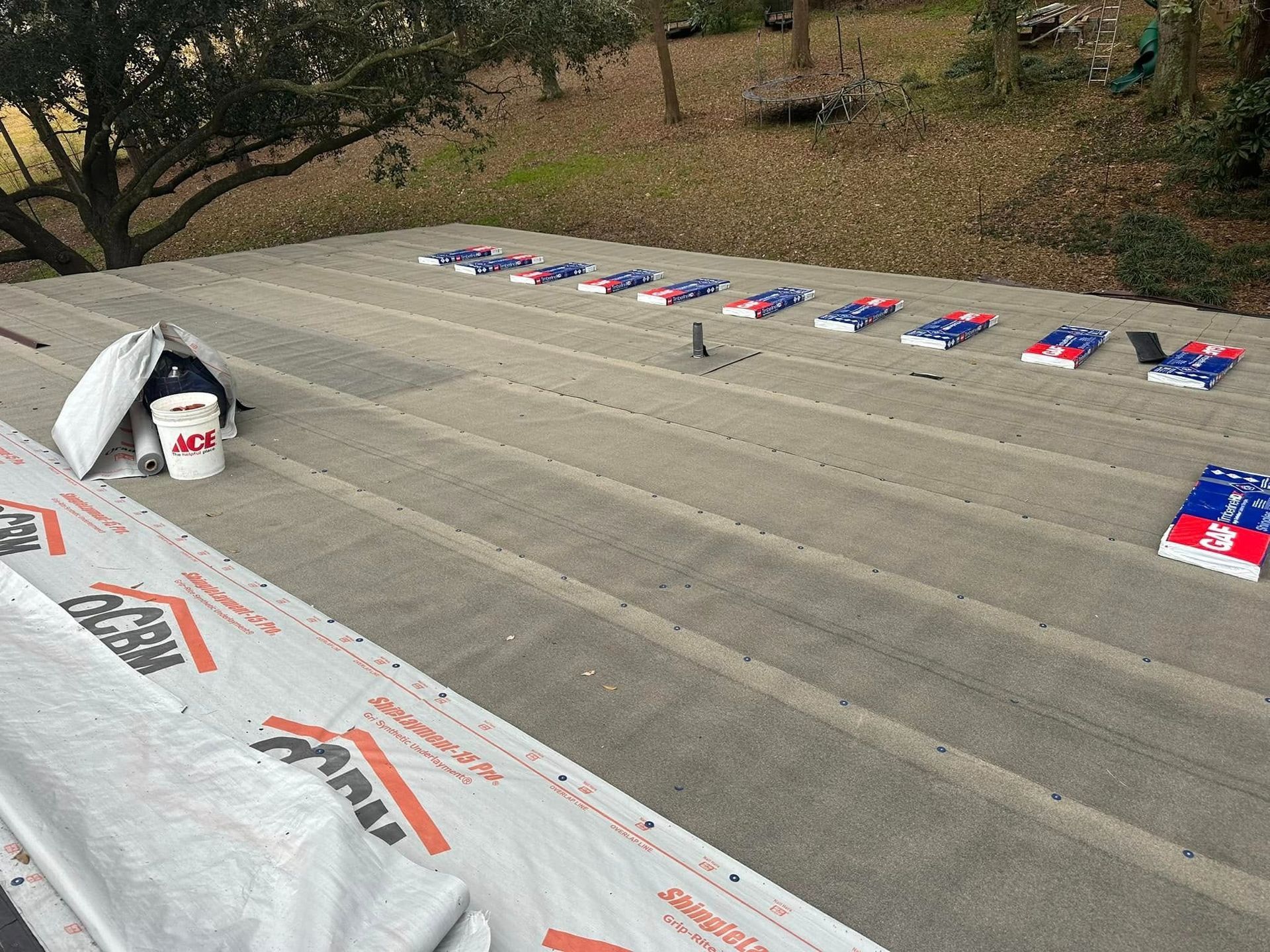 Hundreds of small red, white, and blue flags lined across concrete steps outdoors