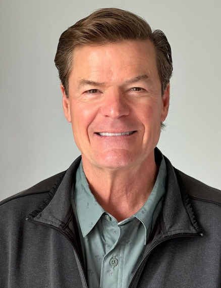 Smiling man in a dark jacket