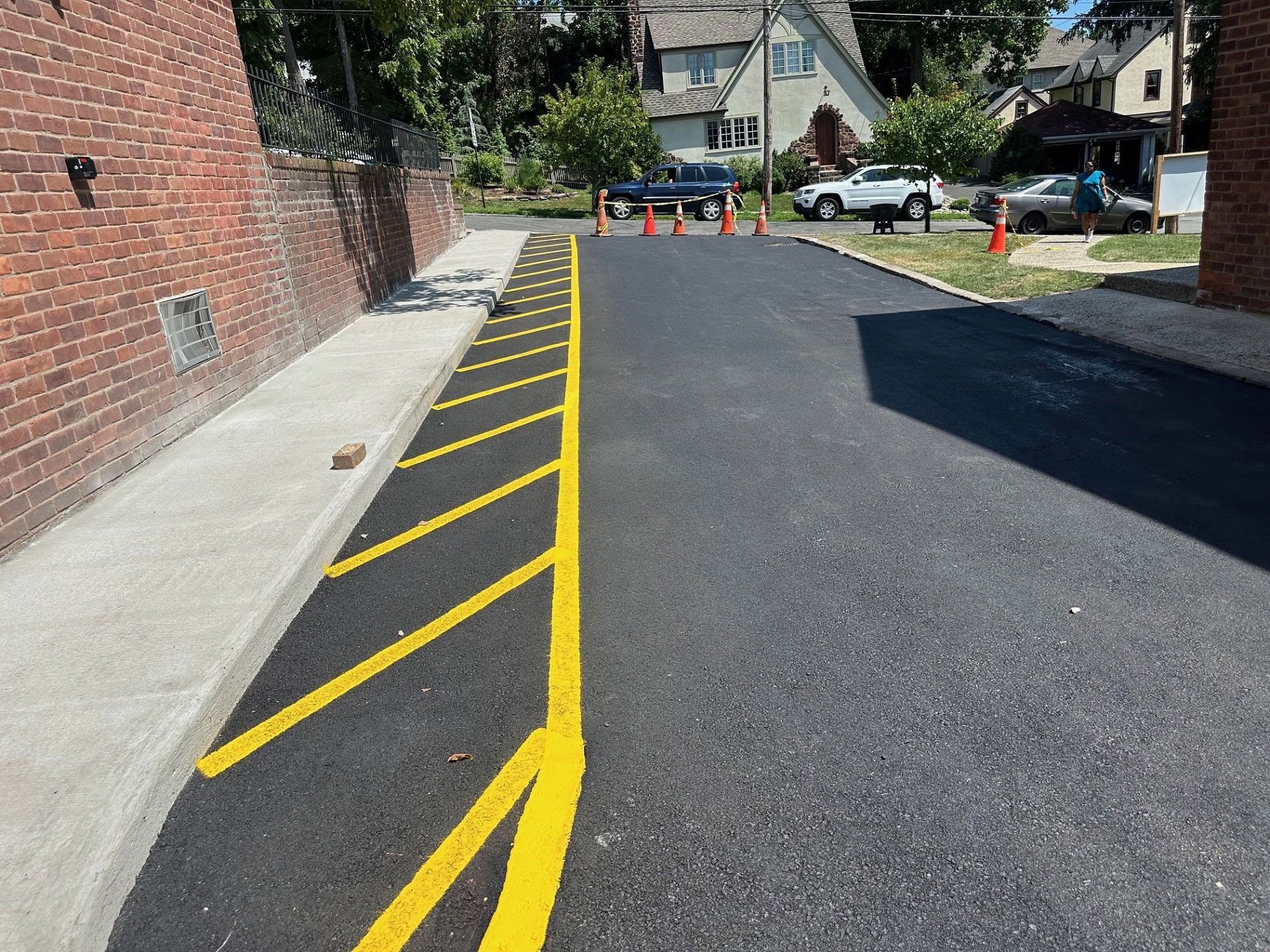 A yellow line is painted on the side of a road