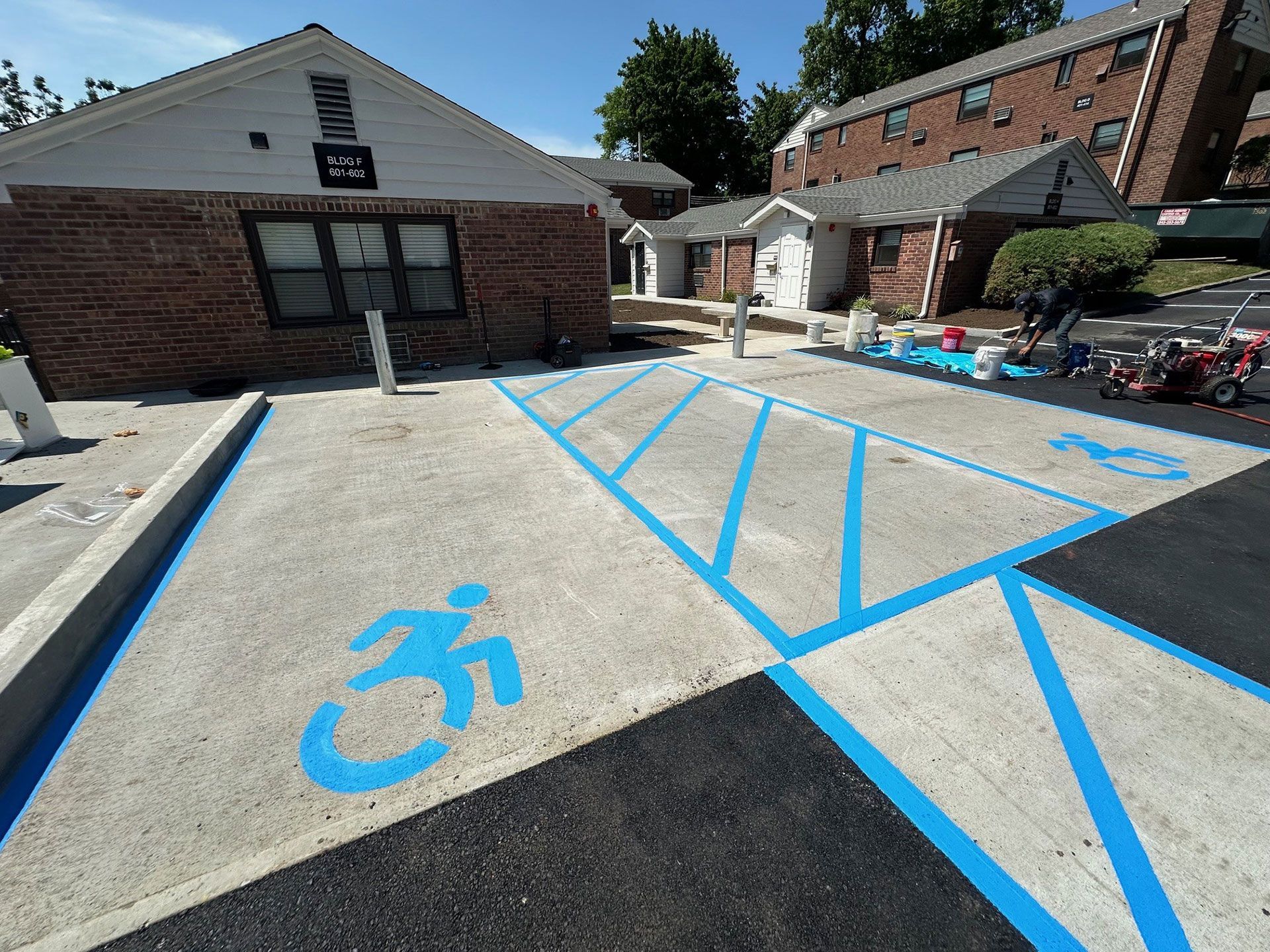 A handicapped parking space with a wheelchair symbol painted on it