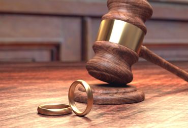 Wedding ring and law gavel