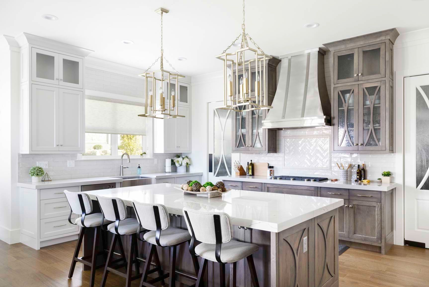 A large kitchen with a large island and stools.