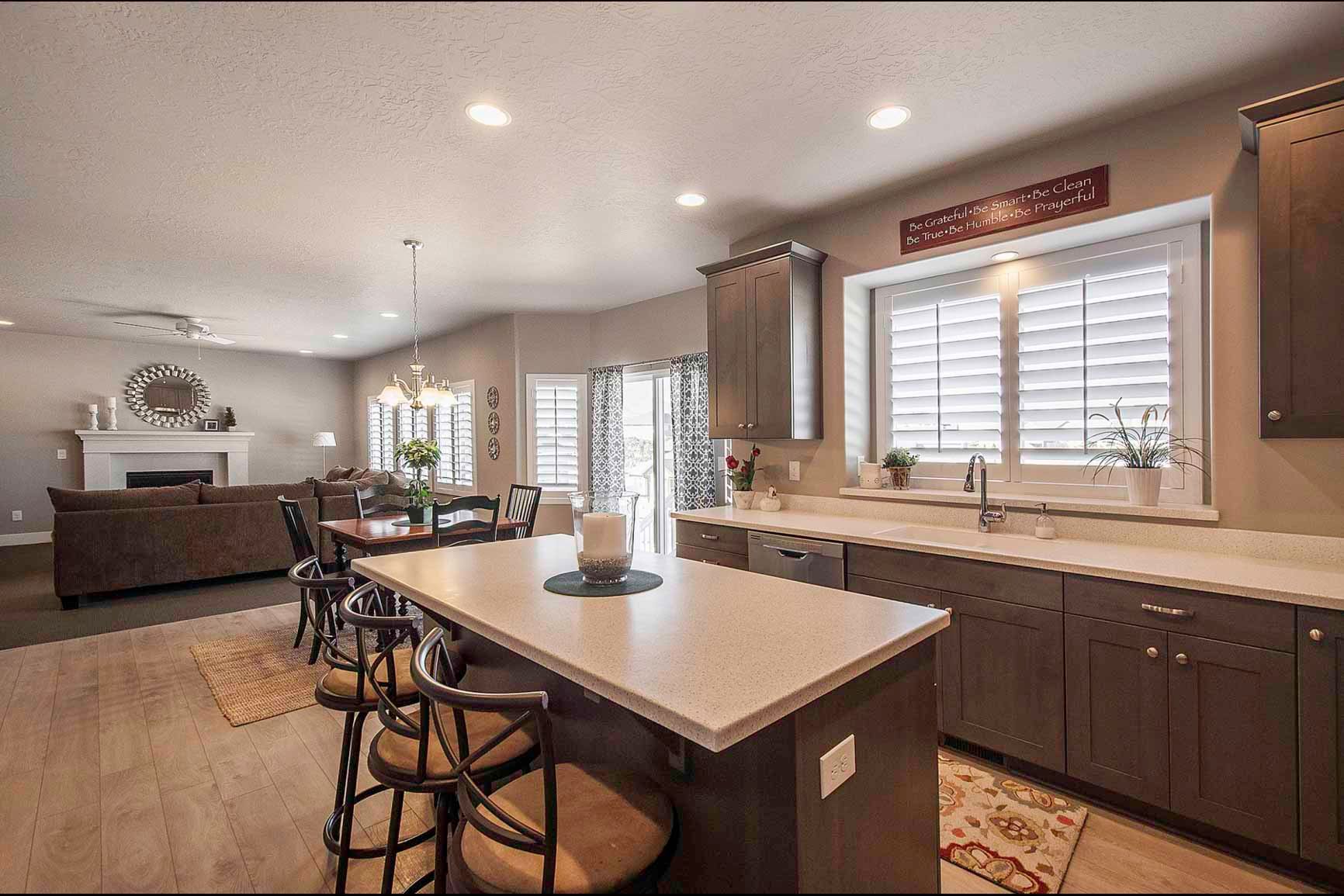 There is a large island in the middle of the kitchen.