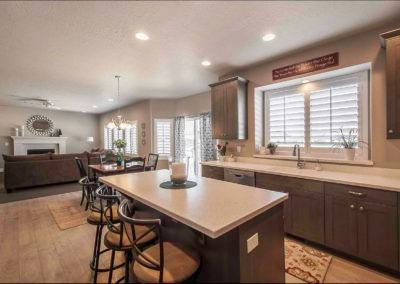 A kitchen with a large island in the middle of the room.