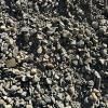 A pile of gravel is sitting on the ground.