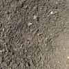 A close up of a pile of gravel on the ground.