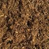 A close up of a pile of brown soil.