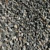 A pile of gravel is sitting on the ground.